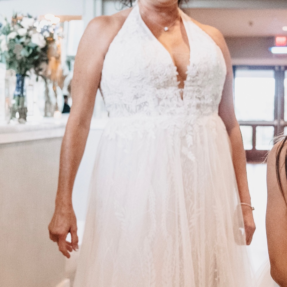 Halter wedding dress , illusion bodice, plunging neck line and sexy side slit.